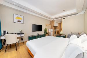 Televizorius ir (arba) pramogų centras apgyvendinimo įstaigoje Raffles Executive Apartment - Guangzhou Huijin International Finance Center, Keyun Road Metro Station Branch-Canton Fair Free Shuttle