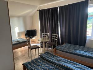En eller flere senger på et rom på Apartmani Andjeo