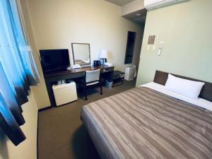Postel nebo postele na pokoji v ubytování Hotel Route-Inn Kamisuwa