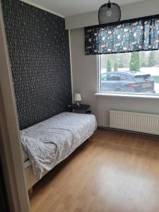 En eller flere senge i et værelse på harjusenkatu 56