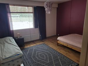 En eller flere senge i et værelse på harjusenkatu 56