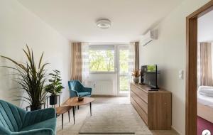 Televízia a/alebo spoločenská miestnosť v ubytovaní Sinus Prémium Aparthotel Siófok