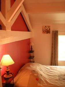 a bedroom with a bed and a book shelf at Ronsard in Bonnes