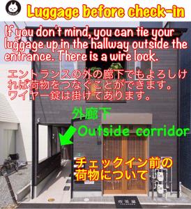 a sign that says language before check in at Nekokura Hostel in Fukuoka