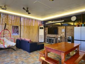a living room with a couch and a table at RMB's Downton Place in Tagaytay