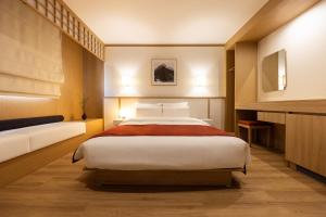 Postel nebo postele na pokoji v ubytování AanK Hotel & Spa Pyeongtaek