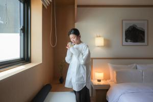 Postel nebo postele na pokoji v ubytování AanK Hotel & Spa Pyeongtaek