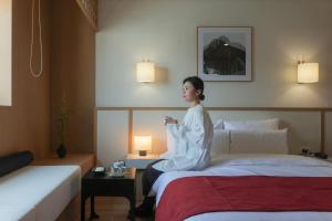 Postel nebo postele na pokoji v ubytování AanK Hotel & Spa Pyeongtaek