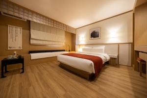 Postel nebo postele na pokoji v ubytování AanK Hotel & Spa Pyeongtaek