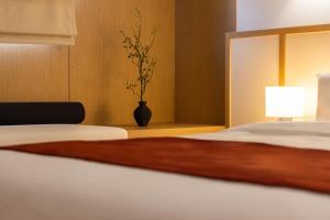 Postel nebo postele na pokoji v ubytování AanK Hotel & Spa Pyeongtaek