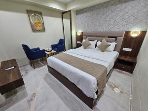Krevet ili kreveti u jedinici u okviru objekta The Eiffel Hotel & Banquet