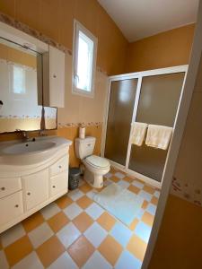 a bathroom with a toilet and a sink and a shower at Dar Rita in Houmt Souk +56 photos
