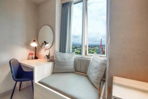Una cama o camas en una habitación de Solaris Hotel Malang