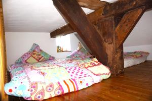 a bedroom with a bed and a wooden floor at Altes Landhaus Oste, Appartement- Hotel mit Kamin in Hemmoor +54 photos