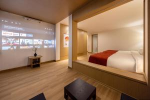 Postel nebo postele na pokoji v ubytování AanK Hotel & Spa Pyeongtaek + 37 fotografií