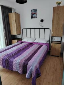 Postel nebo postele na pokoji v ubytování Apart Hotel ART