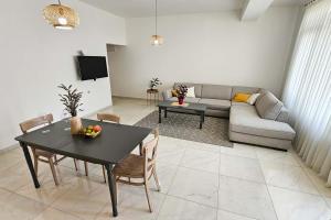 a living room with a table and a couch at Dora in Posušje