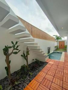 a staircase leading up to a house with cactus at FREE airport pickup for new 2BR villa near Canggu in Sangeh