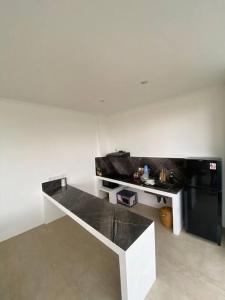a white room with a black and white table at FREE airport pickup for new 2BR villa near Canggu in Sangeh