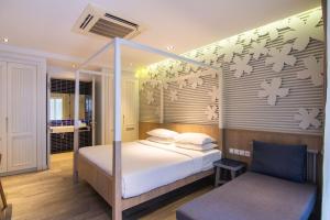 Ein Bett oder Betten in einem Zimmer der Unterkunft Bann Pantai Resort