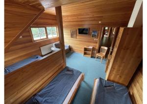 an overhead view of a room with two beds in a cabin at Areál Kamínka - POKOJE A APARTMÁNY in Roštín