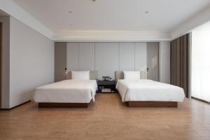 Postel nebo postele na pokoji v ubytování Atour Hotel Guangzhou Yueqiao Branch