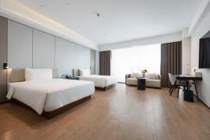 Postel nebo postele na pokoji v ubytování Atour Hotel Guangzhou Yueqiao Branch