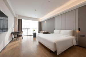 Postel nebo postele na pokoji v ubytování Atour Hotel Guangzhou Yueqiao Branch