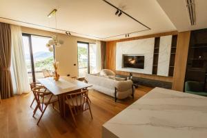 a living room with a couch and a table at Regent Resort Budva in Budva