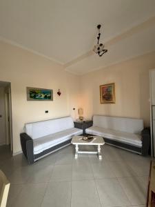 a living room with two beds and a coffee table at Vacation Apartments in Hamallaj in Armath