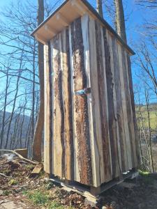 a wooden out house sitting on top of a hill at Wildnis- und Offroad Camp Schwarzwald in Bad Peterstal-Griesbach +2 photos