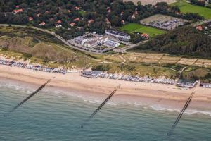 an aerial view of a beach with a resort at Strandhotel Westduin in Koudekerke