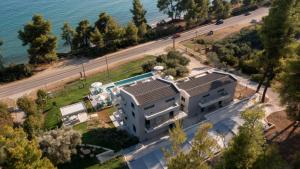 an aerial view of a house with the ocean at Casa de Lapel Mola Kaliva in Mola Kalyva