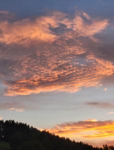 The sunrise or sunset as seen from a vendégházakat or nearby