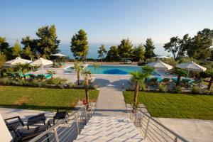 a view of a resort with a swimming pool at Casa de Lapel Mola Kaliva in Mola Kalyva