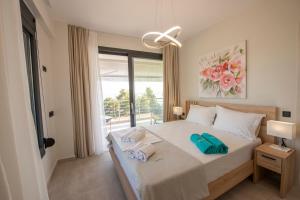 a bedroom with a bed with towels on it at Casa de Lapel Mola Kaliva in Mola Kalyva +55 photos