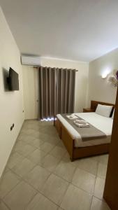 Postel nebo postele na pokoji v ubytování Relax Apartment & Hotel