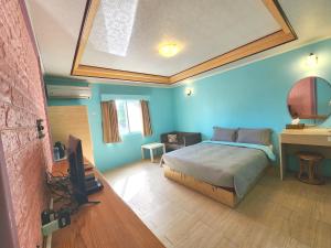 Postel nebo postele na pokoji v ubytování 大潭山莊 Da Tan Mountain INN