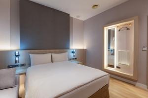 Postel nebo postele na pokoji v ubytování Fu Hsiang Hotel