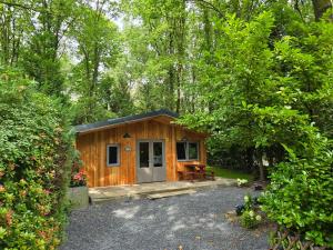 Zahrada ubytování Tiny Lodge met prive Jacuzzi