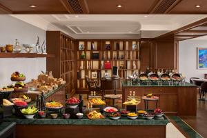 a buffet in a hotel with many different types of food at The Ritz-Carlton, Istanbul at the Bosphorus in Istanbul