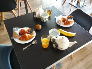 Hommikusöögi valikud saadaval majutusasutuse Brit Hotel L'Arrivée Guingamp külastajatele