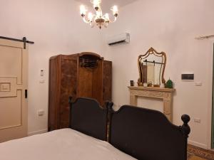 Posteľ alebo postele v izbe v ubytovaní le dimore del tufo