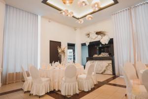 TV a/nebo společenská místnost v ubytování Hotel Aurelia