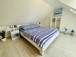 Postel nebo postele na pokoji v ubytování Ferienwohnung in Timmendorfer Strand, Niendorf an der Ostsee