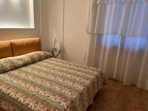 Postel nebo postele na pokoji v ubytování Residenza Sandrini