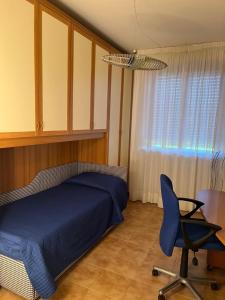 Postel nebo postele na pokoji v ubytování Residenza Sandrini
