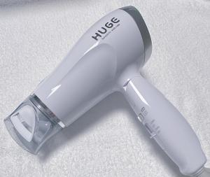 a electric hair drier is sitting on the floor at Nissay Hotel Fukuoka - Vacation STAY 79962v in Fukuoka +1 photo