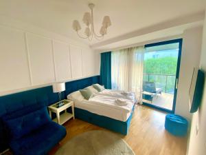 Posteľ alebo postele v izbe v ubytovaní Seaside Park Apartament z widokiem na morze
