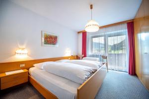 Postel nebo postele na pokoji v ubytování Alara Rooms